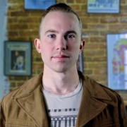 Young man with close-cropped dark hair